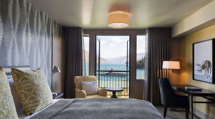Standard room with queen bed, wool throws and lake breeze balcony